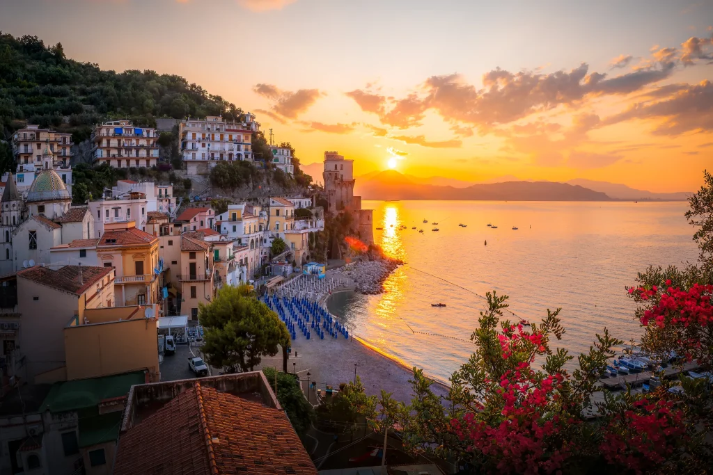 Sunset over Cetara village beach and medieval tower, Amalfi Coast
