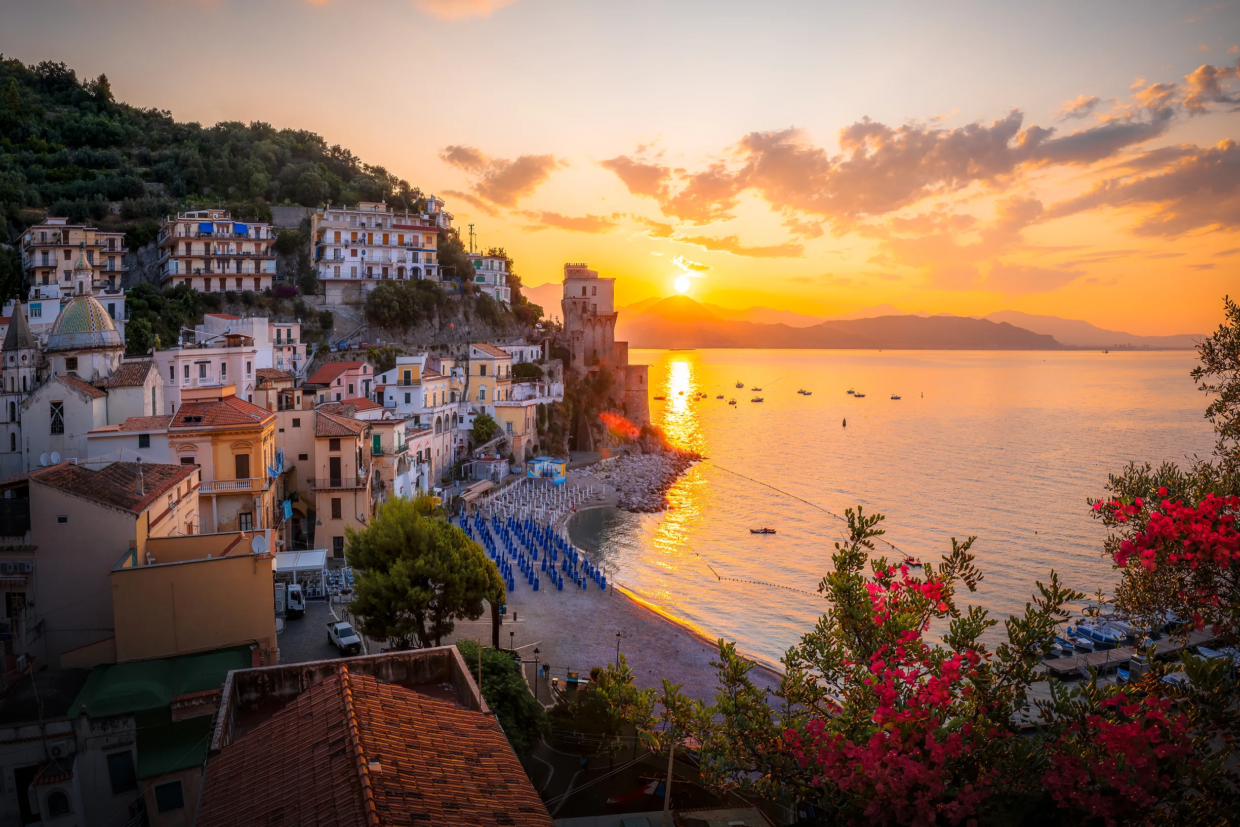 Sunset over Cetara village beach and medieval tower, Amalfi Coast